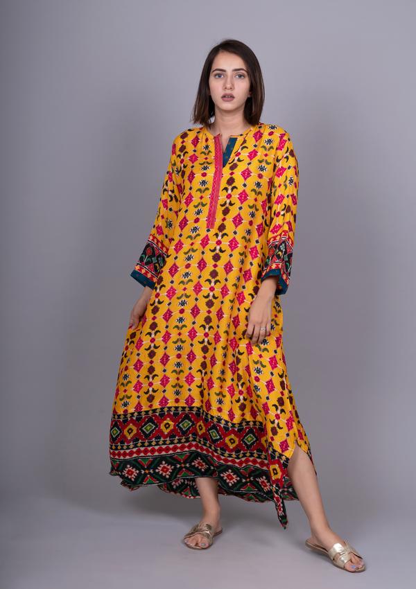 Meghna Panchmatia Yellow Patola Printed Kurta with Asymmetric Hemline.