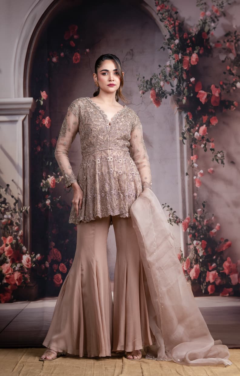 Just like that: Champagne Embroidered Peplum Sharara Set with Net Dupatta