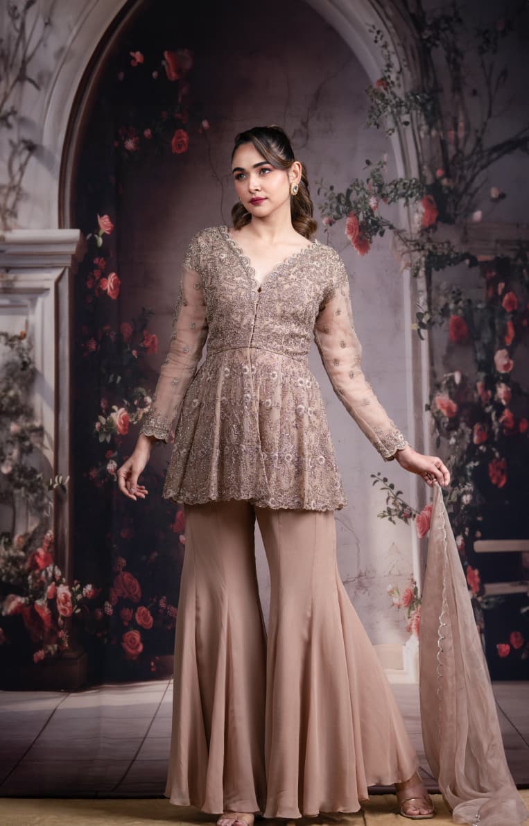 Just like that: Champagne Embroidered Peplum Sharara Set with Net Dupatta
