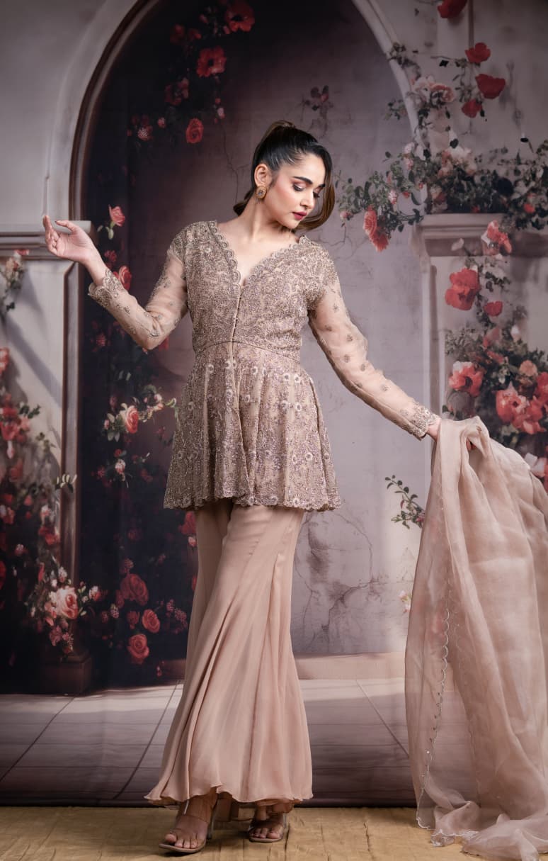 Just like that: Champagne Embroidered Peplum Sharara Set with Net Dupatta
