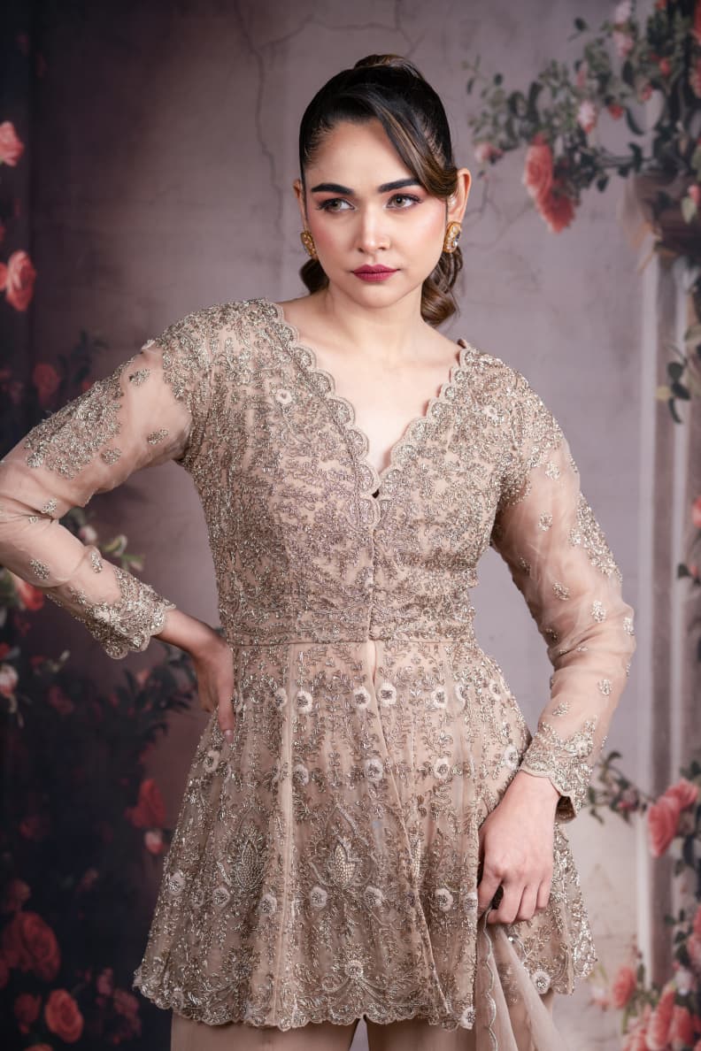 Just like that: Champagne Embroidered Peplum Sharara Set with Net Dupatta